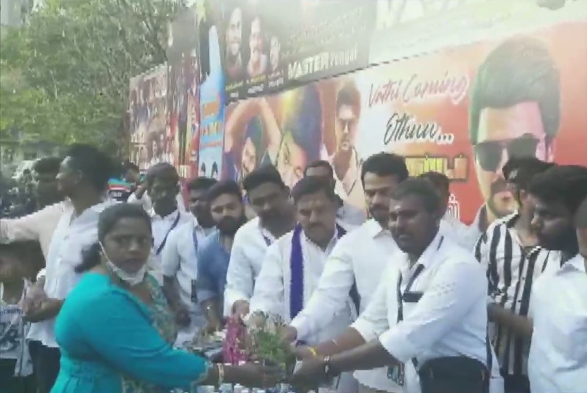 Actor Vijay's fans celebrate outside Carnival Cinema in Wadala