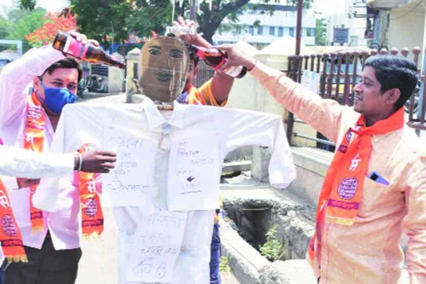 Alcohol anointing to the statue of the Mahavikas Aghadi government