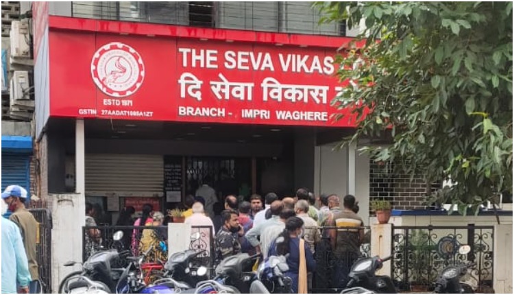 Crowd of account holders to withdraw money at Seva Vikas Bank
