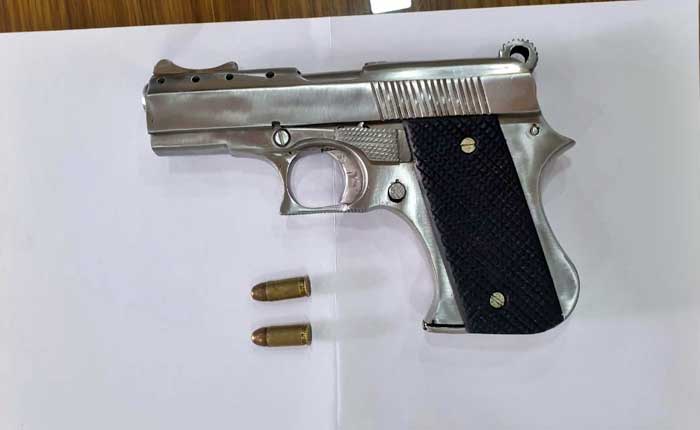 One arrested for carrying pistol, two live cartridges