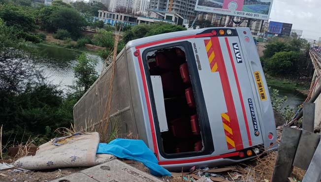 The bus crashed into a ditch near the river bed on the highway at Wakad