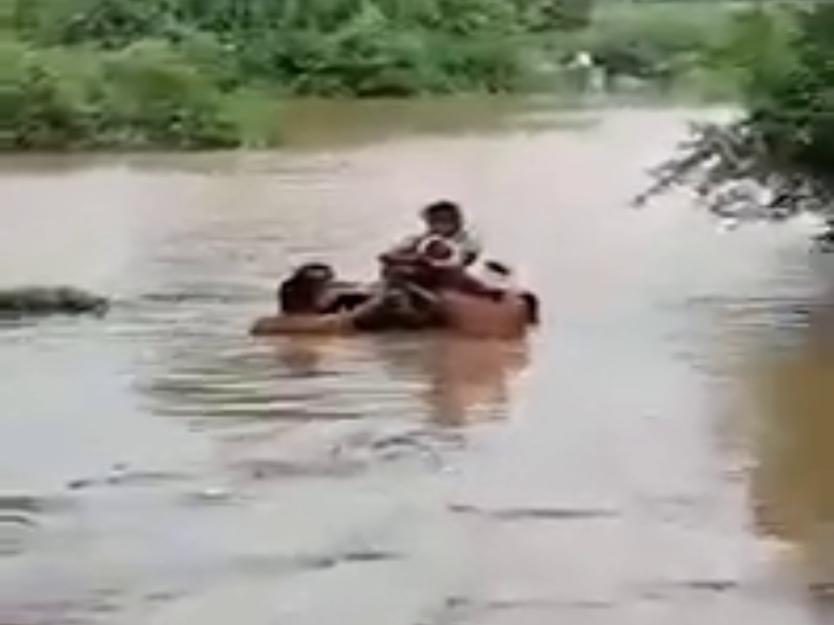 A mother made her way through the flood to save the life of a sick child
