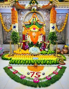 Decoration of fruits and flowers of 3 colors of tricolor flag to Shri Chintamani Ganapati at Theur