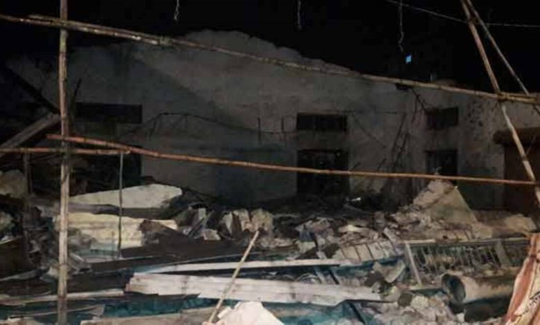 A woman and a six-month-old child were injured when the wall collapsed