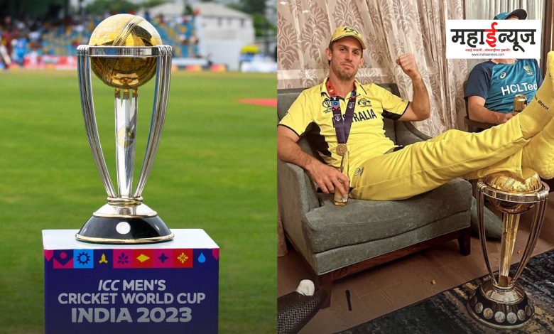 Australia's batsman Mitchell Marsh sat on the World Cup trophy