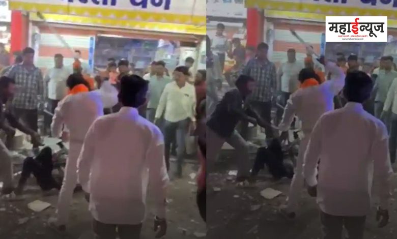 MLA Sanjay Gaikwad beating the youth with a stick