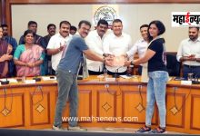 Thergaon's 'Ironman' couple felicitated by Standing Committee Chairman Abhishek Barne.